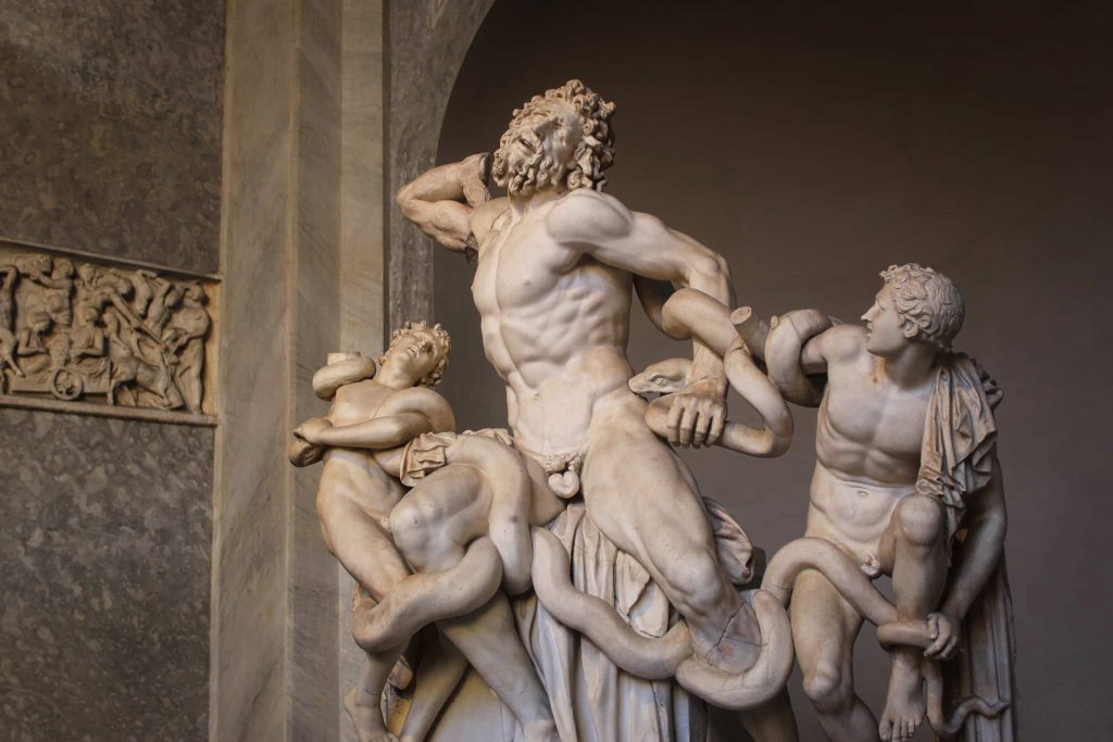 Statue of Laocoön and His Sons entwined by sea serpents, a famous Hellenistic sculpture displayed in the Vatican Museums.